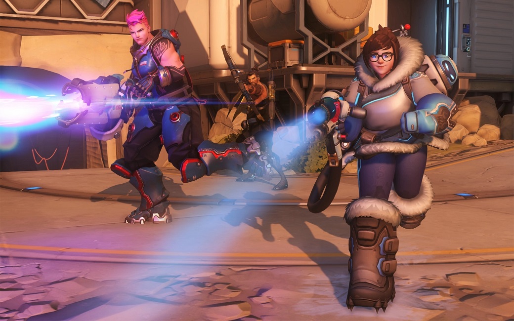 Overwatch heroes Zarya and Mei charging toward the camera in a screenshot of gameplay.