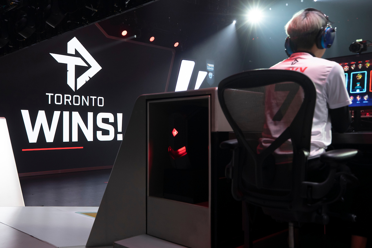 Toronto Defiant Overwatch League player on stage after a win.