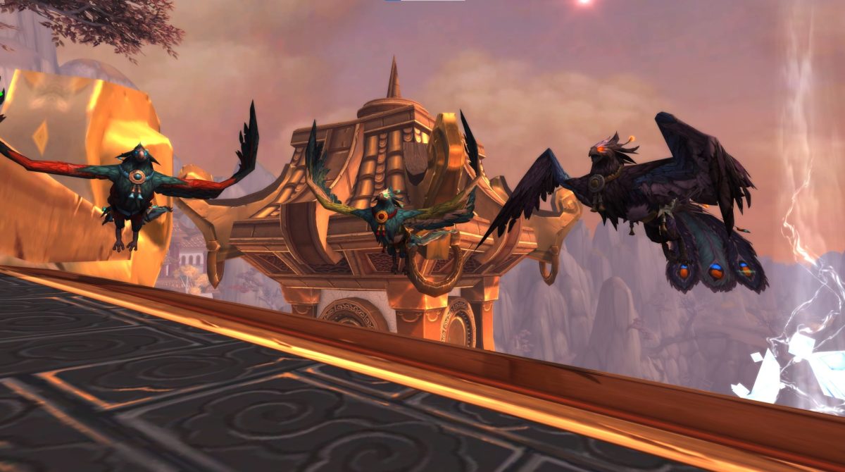 The Pandaren Phoenix mounts flying in the Vale of Eternal Blossoms.