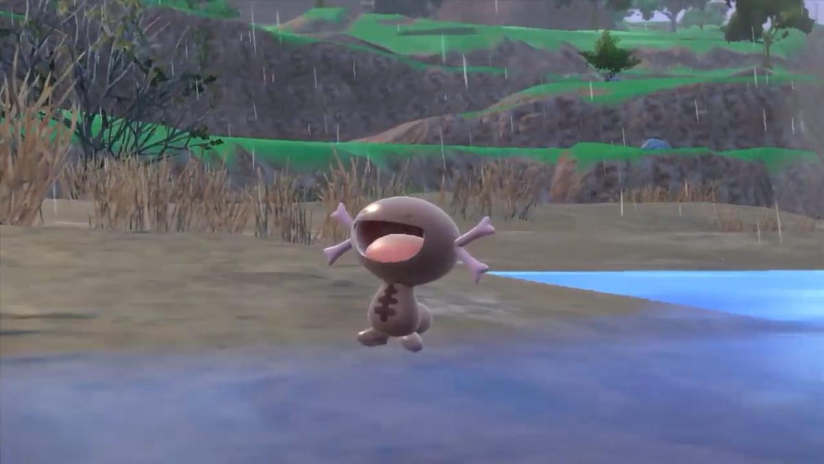 A Paldean Wooper opens its mouth happily.