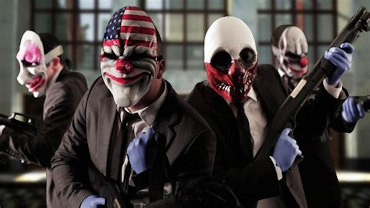 The heist team from Payday 3, dressed in clown masks and heavily armed, stare forward.