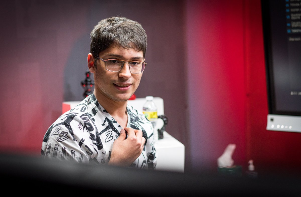 Alireza Firouzja, a world-class chess player, sits in a room playing chess.