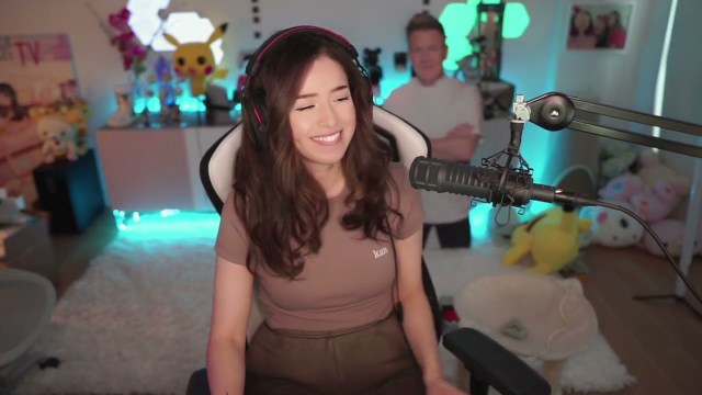 Pokimane talks to her streaming fans while sitting in her setup in front of her PC