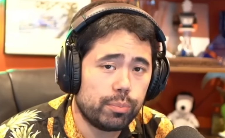 Hikaru wearing a black and yellow shirt, looking directly at the camera.