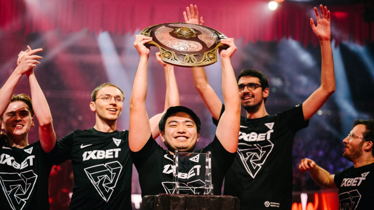 Tundra Dota 2 team lifting the Aegis trophy at TI11.