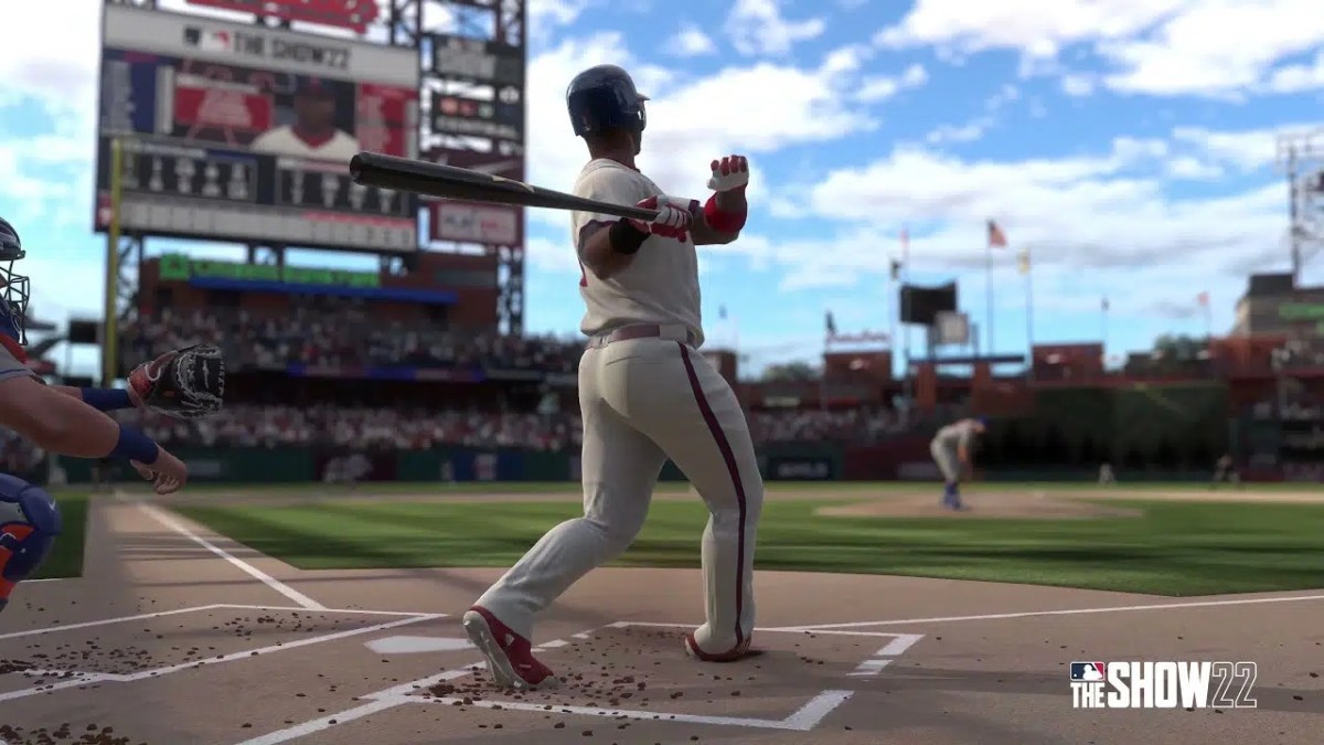 A baseball batter swings at a pitch in a field in MLB The Show 2023.