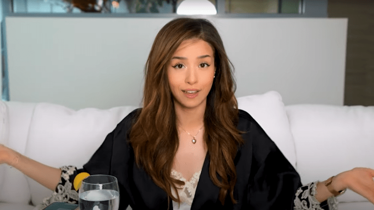 Pokimane shrugging at the camera.