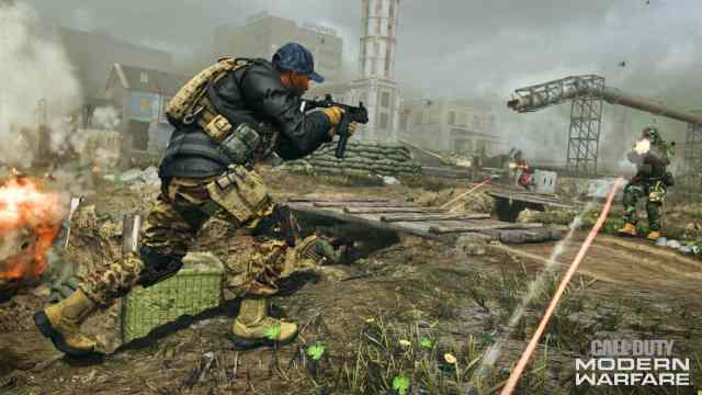 Call of Duty: Modern Warfare promo image with two men shooting at each other in a destroyed warzone