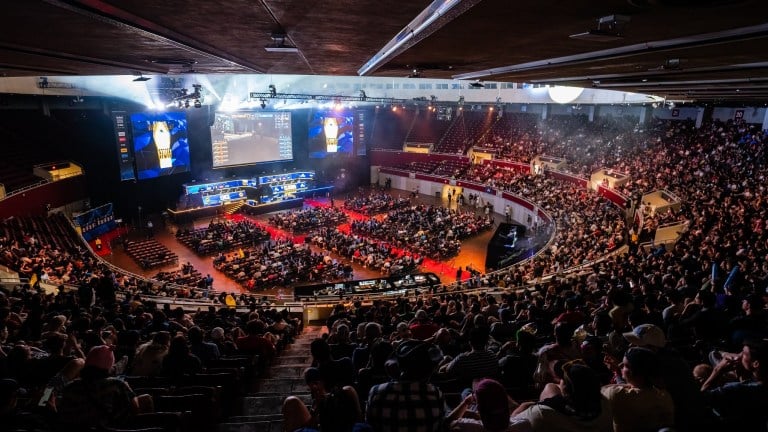 CS:GO fans spectating a match in an arena.