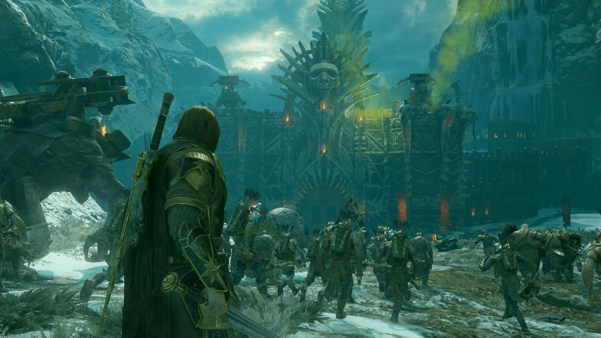 talion leads an army of orcs against a fortification with a large skull on it in mordor