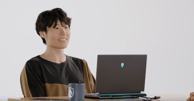 Disguised Toast in front of an Alienware laptop.