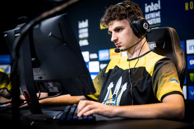 Woro2k, a Ukrainian Counter-Strike 2 player, sits at his PC playing CS2.