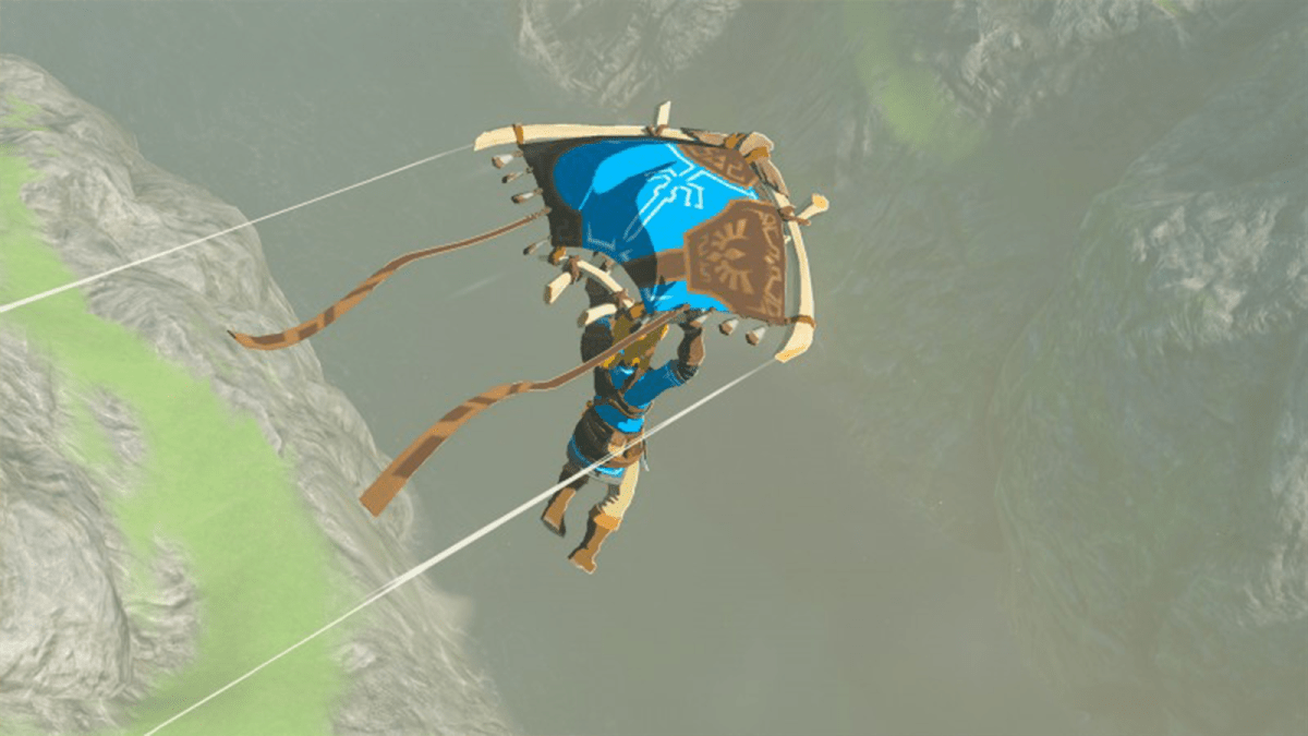 A character holding onto a paraglider, flying around the land in Zelda: Tears of the Kingdom.