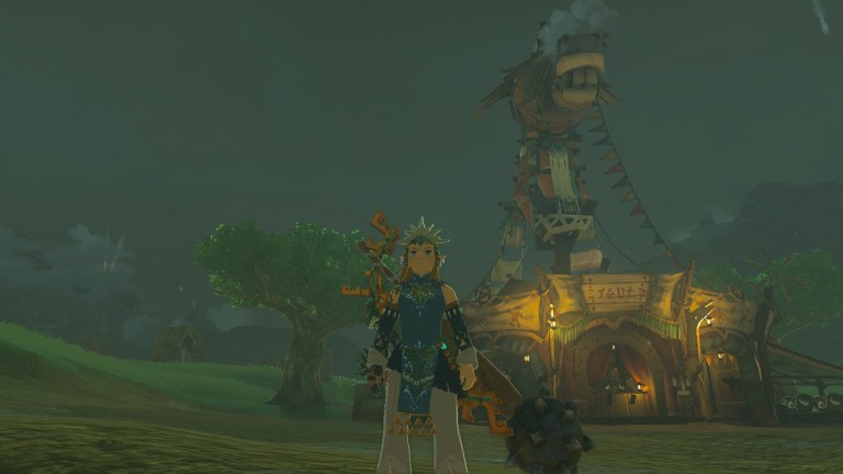 Link stands in front of a stable in Tears of the Kingdom.