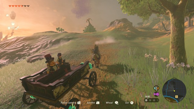 Link towing a cart up a hill.