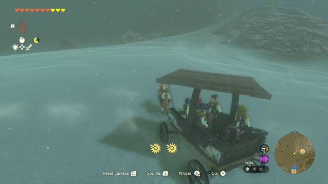 Link towing a wagon up a snowy slope