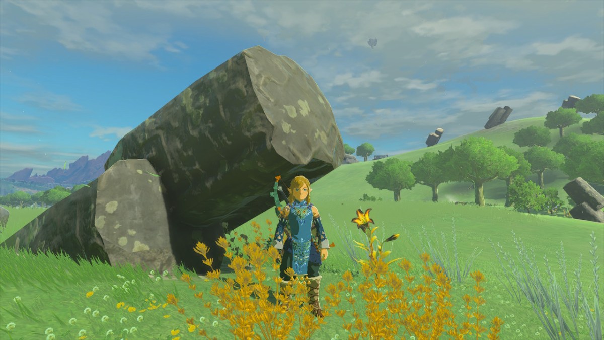 Link standing next to a large boulder in tears of the kingdom