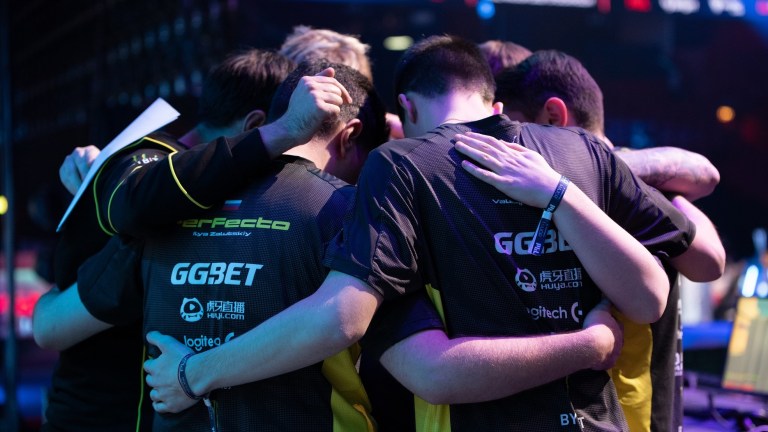 NAVI huddle together during PGL Stockholm Major in 2021.