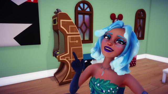 The player taking a selfie with the brown coin-op game in Minnie's house.
