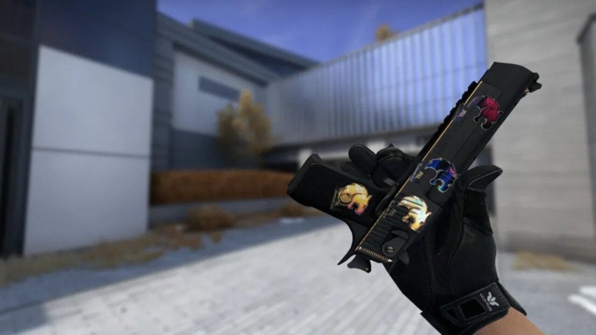 Player holding Glock with FURIA PGL Antwerp sticker on Vertigo