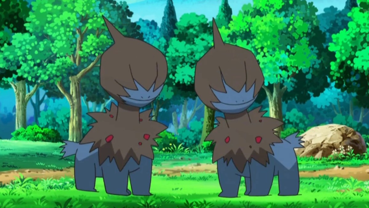 Two Deino standing side-by-side in a forest in the Pokémon anime.