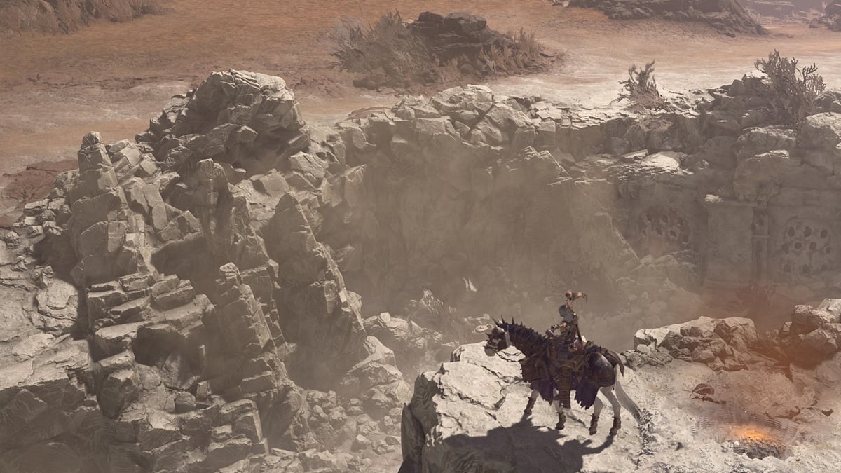 A player prepares to resume travel from a camp in Diablo 4, looking out over a rocky outcrop on their horse.