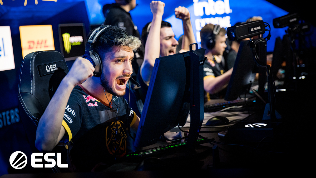 NertZ, alongside the rest of the ENCE squad, cheer at their desks after claiming victory over FaZe Clan at IEM Dallas.