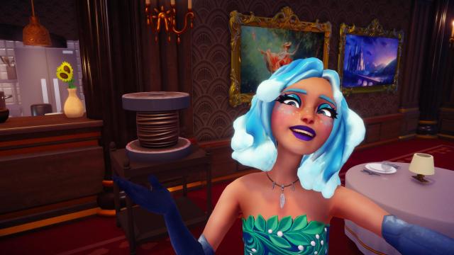 The player taking a selfie with a spool that is actually Remy's new espresso machine.