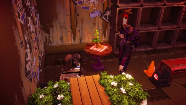 The player talking to Wall-E in his house.