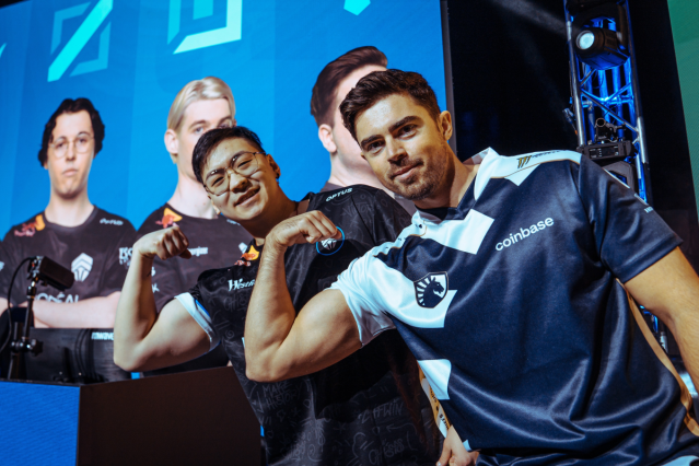 League players Midbeast and Dragku flex on-stage at the LCO finals in Melbourne.