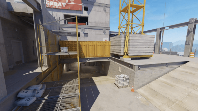 Screenshot of CS2 map Vertigo. The map has bright colors and the screenshot shows the the ramp that gives access to the A bombsite.