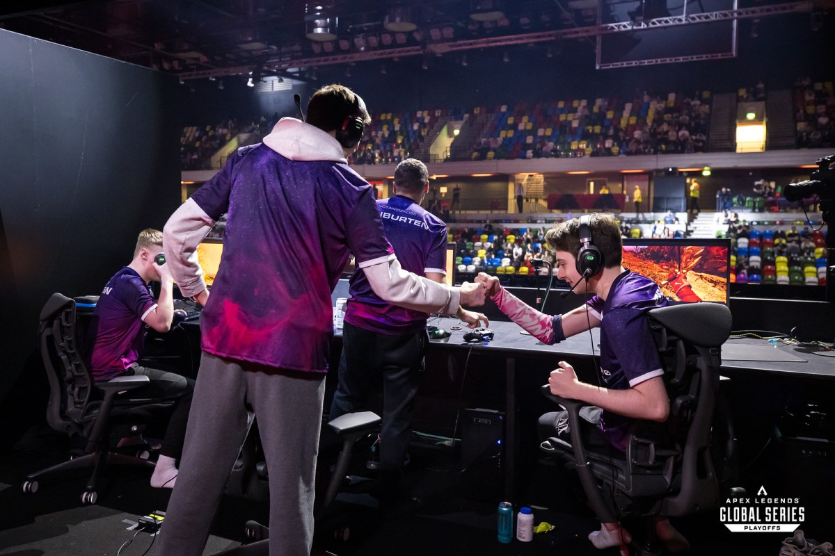 DarkZero coach zz stands by Genburten, Zer0 and Xynew on the LAN stage in the Copper Box Arena.