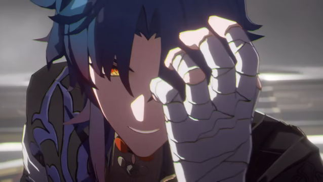 A close up shot of Blade's face with his hand raised to cover half of it as he grimaces in pain.