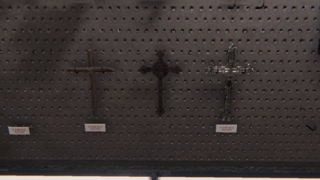 The three types of Crucifix hanging on a wall in Phasmophobia.