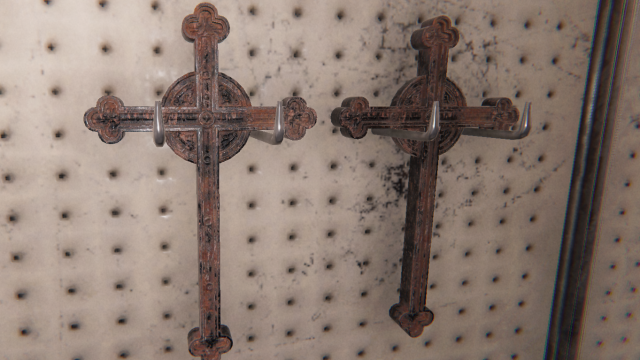 Two Crucifixes hanging on a wall.