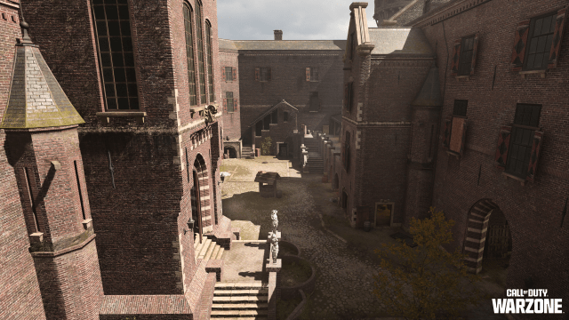 A castle's courtyard. Red brick enclosure with white fountains and stone staircases inside of the castle in Vondel in DMZ.