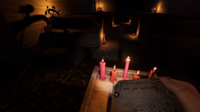 The Player holding a Monkey Paw tag that reads "I wish for activity" while in the chapel of  Sunny Meadows Mental Institution in Phasmophobia.