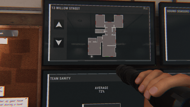 The player looking at the sanity board and a map of 13 Willow Street in the van while holding a flashlight. 