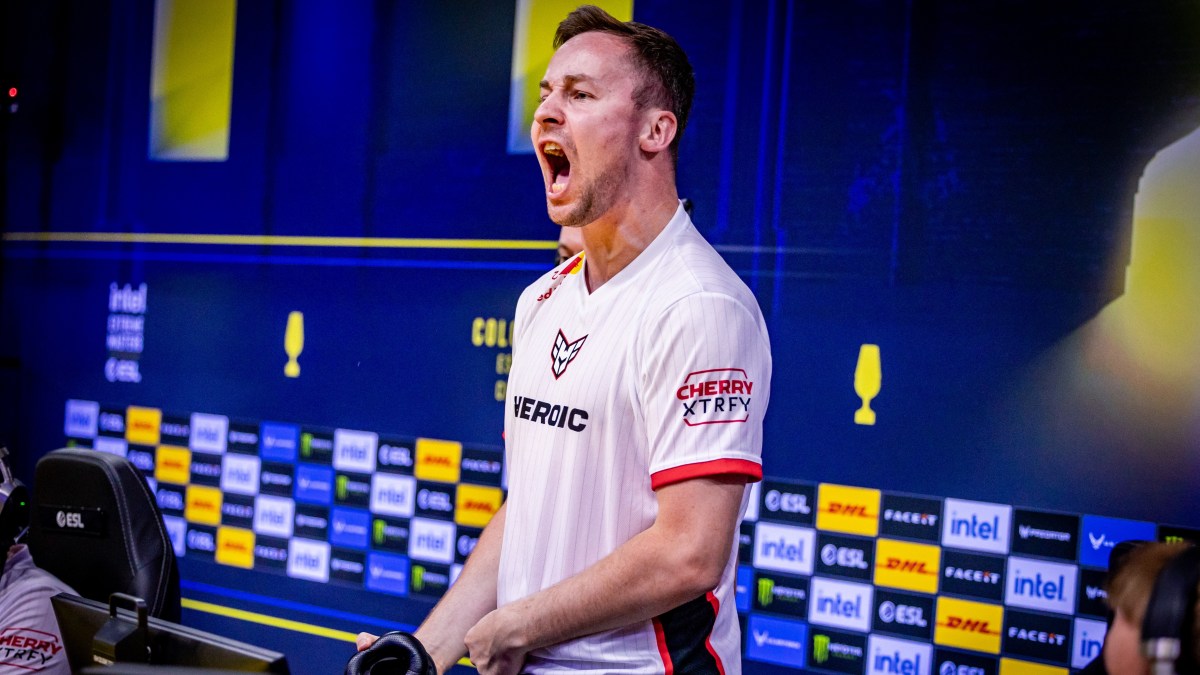 Heroic's cadiaN standing up and screaming after winning a map at IEM Cologne 2023.