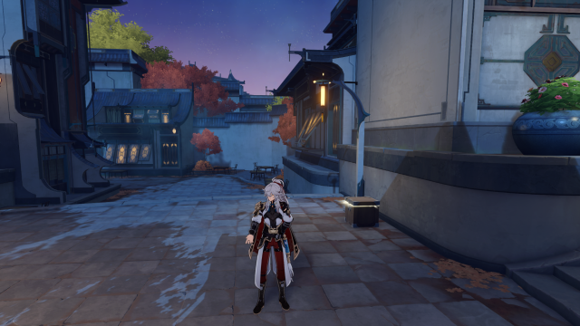 Jing Yuan talking in front of a chest.