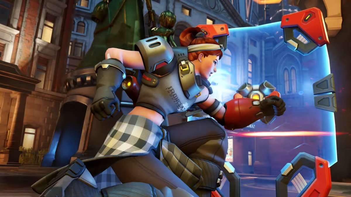 Brigitte takes cover with her shield in Overwatch 2.