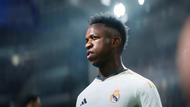 Real Madrid forward Vinicius Jr stood in front of floodlights in EA FC 24.