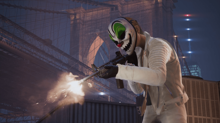 Image displays a heister in a clown mask and white suit firing a machine gun near a bridge.