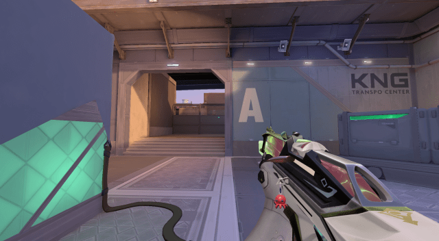 Deadlock holding the A Elbow opening toward site on VALORANT's Sunset.