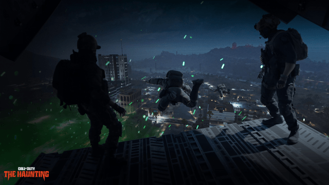 Three operators drop from a cargo plane into a night-time version of Al Mazrah, a desert map in Call of Duty.