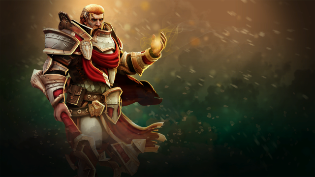 Omniknight, a warrior in red and gold armor, clutches his hand around gold energy in Dota 2.