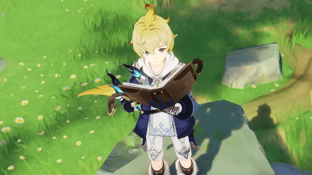 Mika holding a book and looking up.
