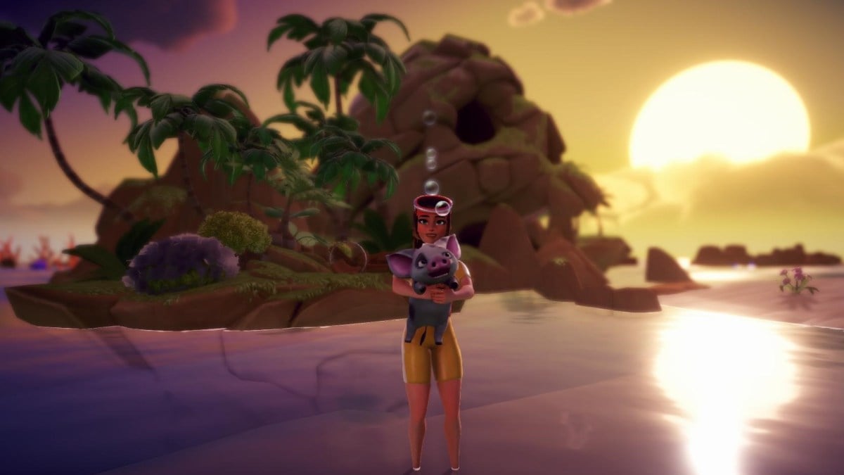 The player holding Pua while standing in water on the beach during a sunset.