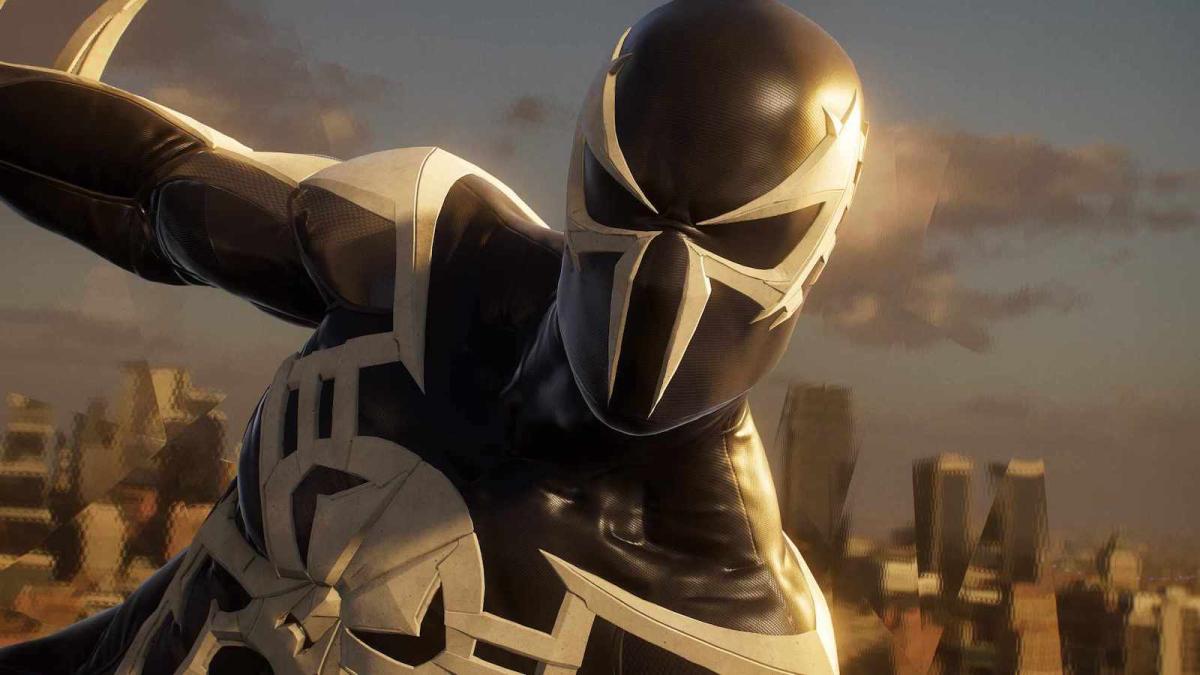 Spider-Man looking at the camera while hanging onto a building