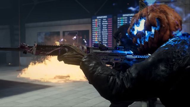 Image from the Call of Duty Haunting event with a character wearing a glowing blue pumpkin mask with guns and flames in the background.
